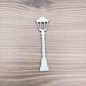 Utcai lámpa fa figura